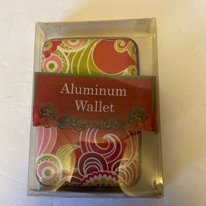 NWT. Aluminum wallet. Still in original packaging.